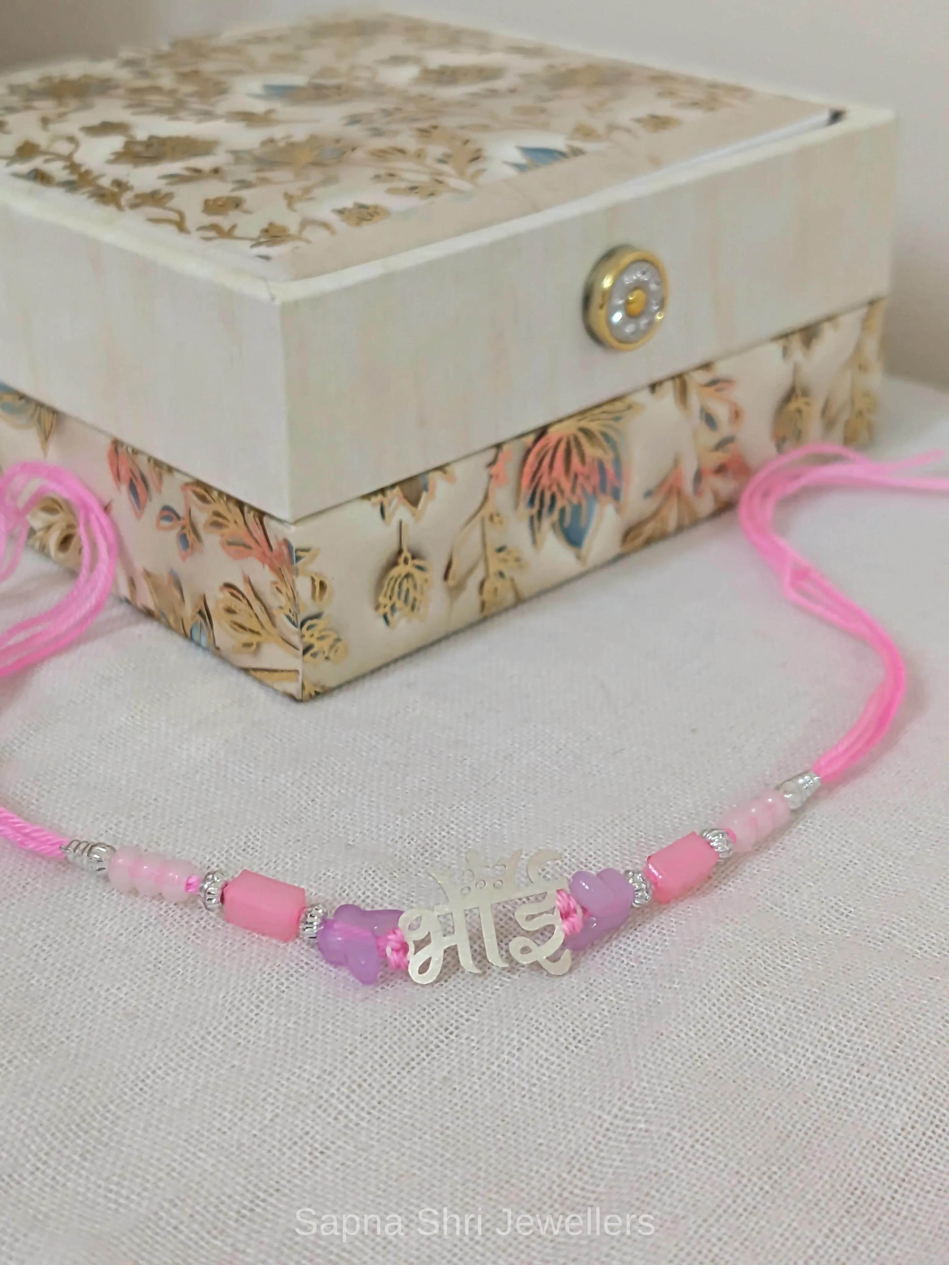 Bhai Silver Rakhi with Pink & Purple Beads - Image 1 of 4 Bhai Silver Rakhi with Pink & Purple Beads - View 1