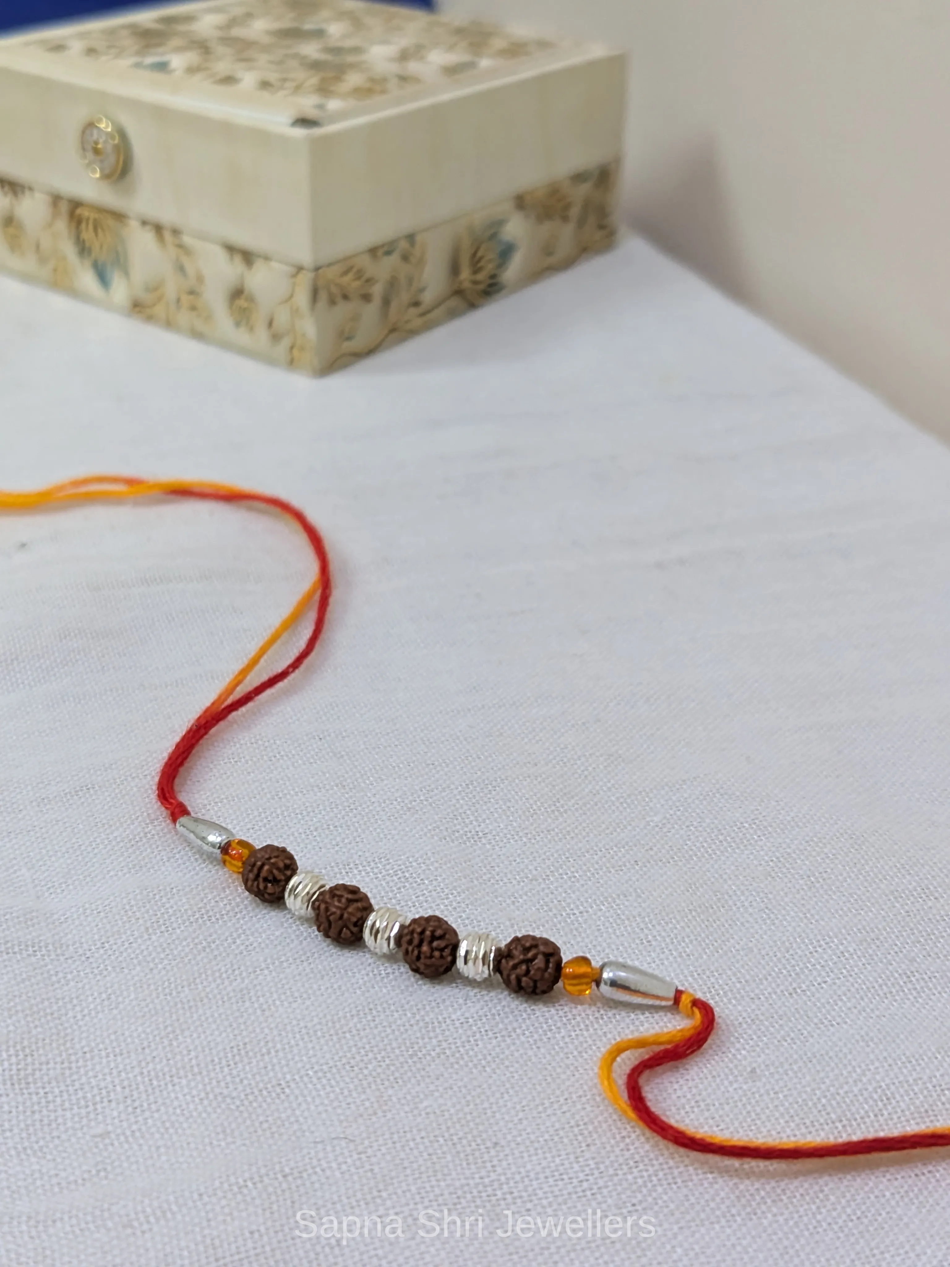 925 Silver Rudraksha Beads Rakhi with Traditional Mauli Thread - Image 1 of 4 925 Silver Rudraksha Beads Rakhi with Traditional Mauli Thread - View 1