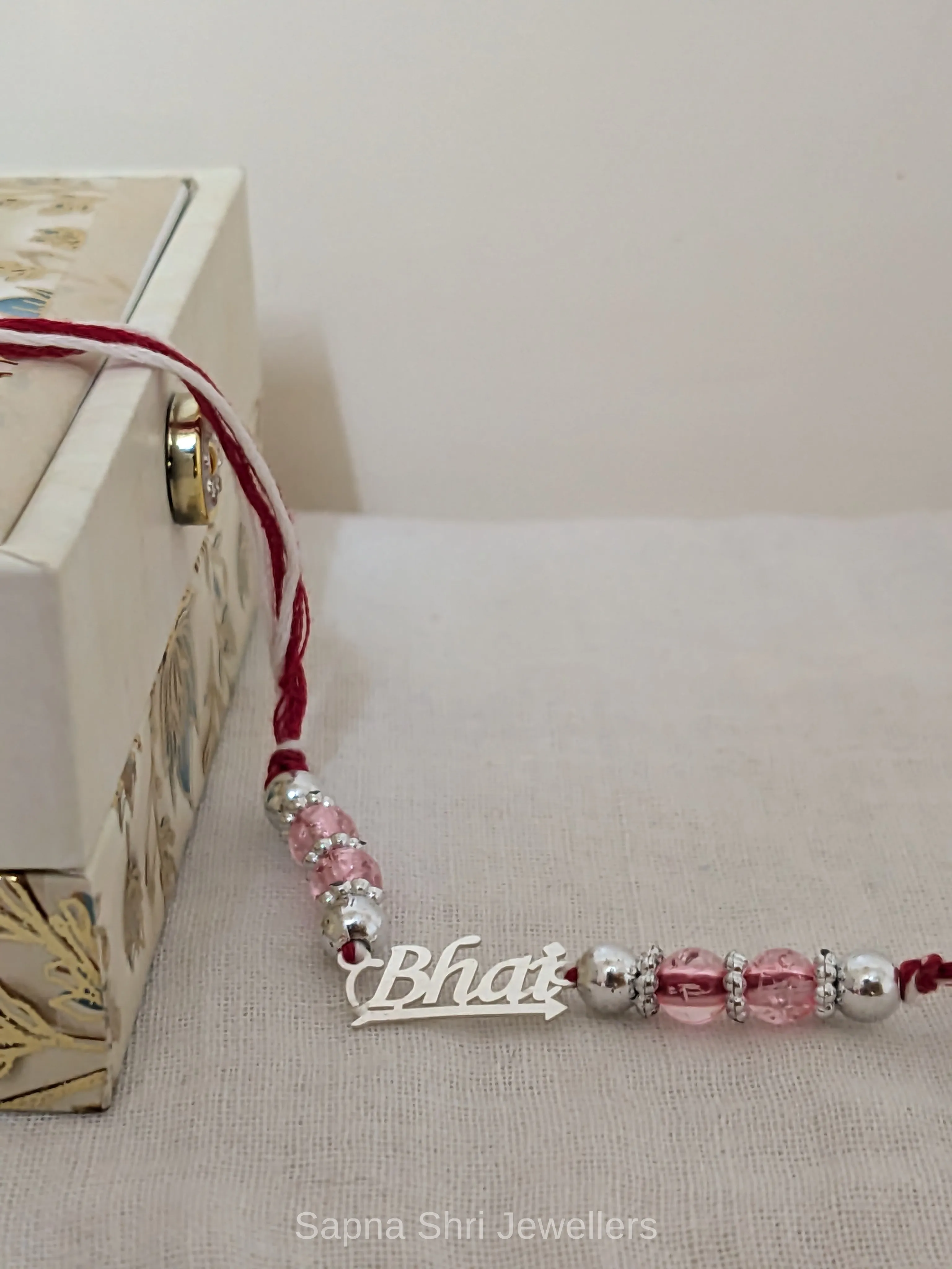 Pink Bead Bhai Silver Rakhi – Elegant Silver Rakhi for Brother - Image 1 of 4 Pink Bead Bhai Silver Rakhi – Elegant Silver Rakhi for Brother - View 1