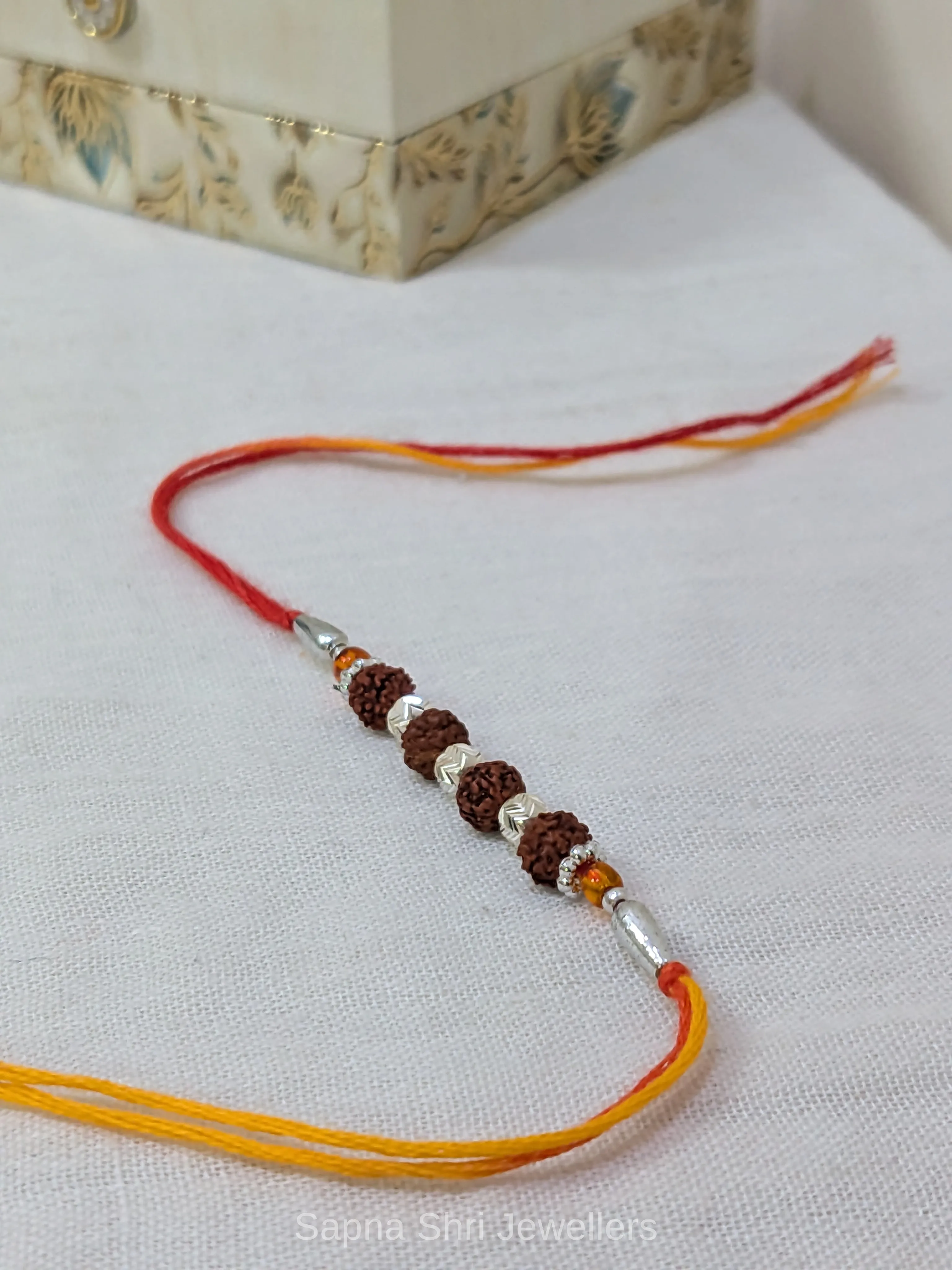 925 Silver Five Rudraksha Rakhi with Silver Beads & Traditional Thread - Image 1 of 4 925 Silver Five Rudraksha Rakhi with Silver Beads & Traditional Thread - View 1