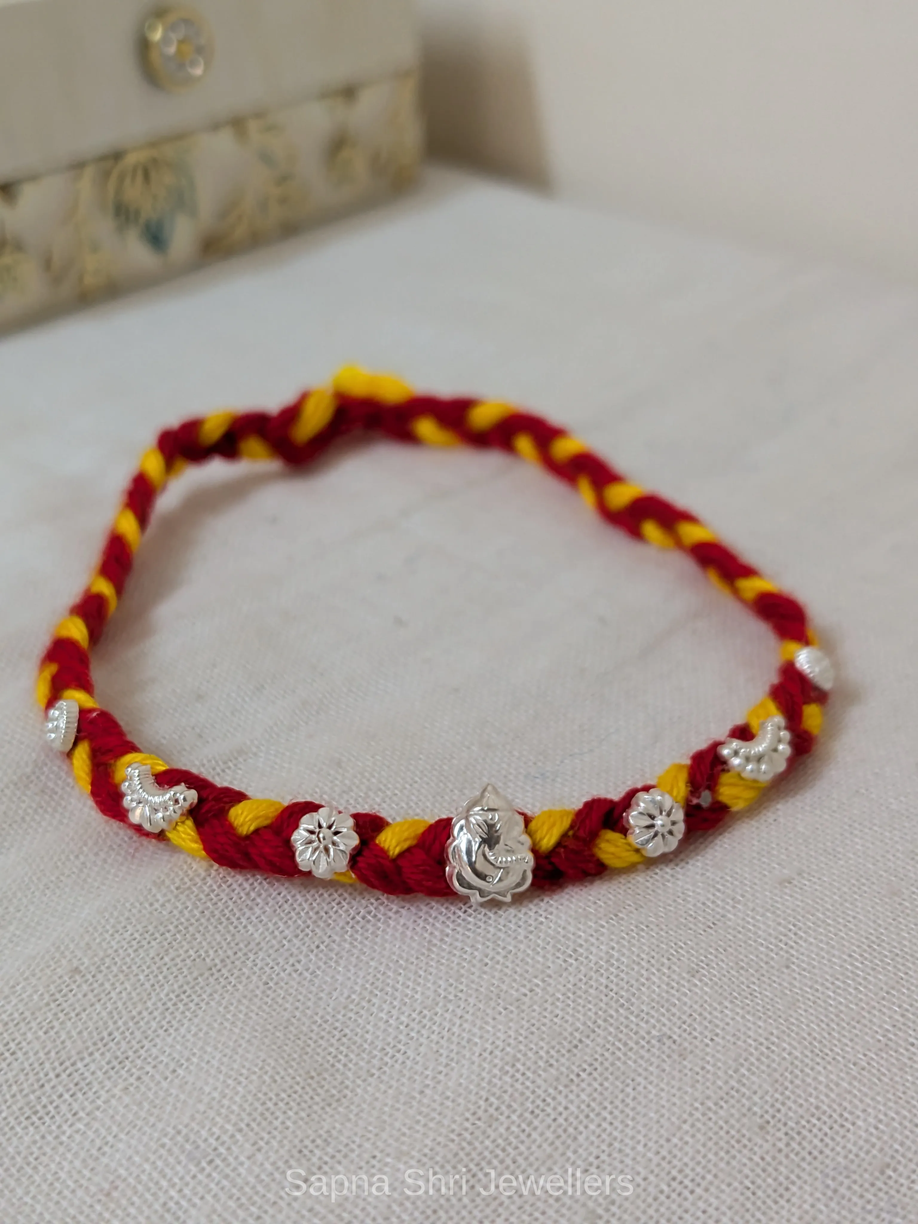 Ganesh Floral Silver Rakhi – Traditional Red Yellow Silver Rakhi thumbnail 4