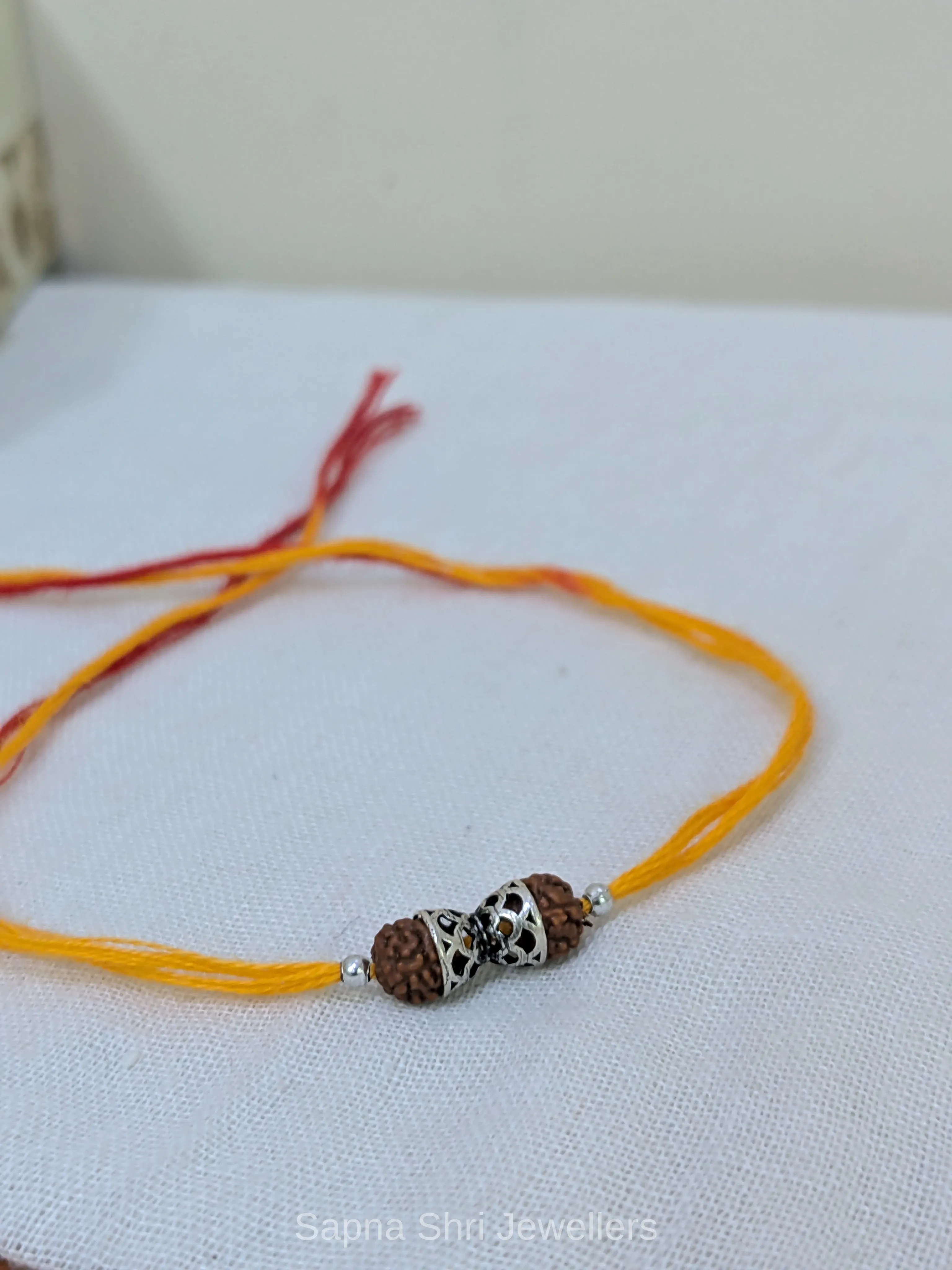 925 Silver Rudraksha Rakhi with Designer Silver Caps & Mauli Thread thumbnail 2