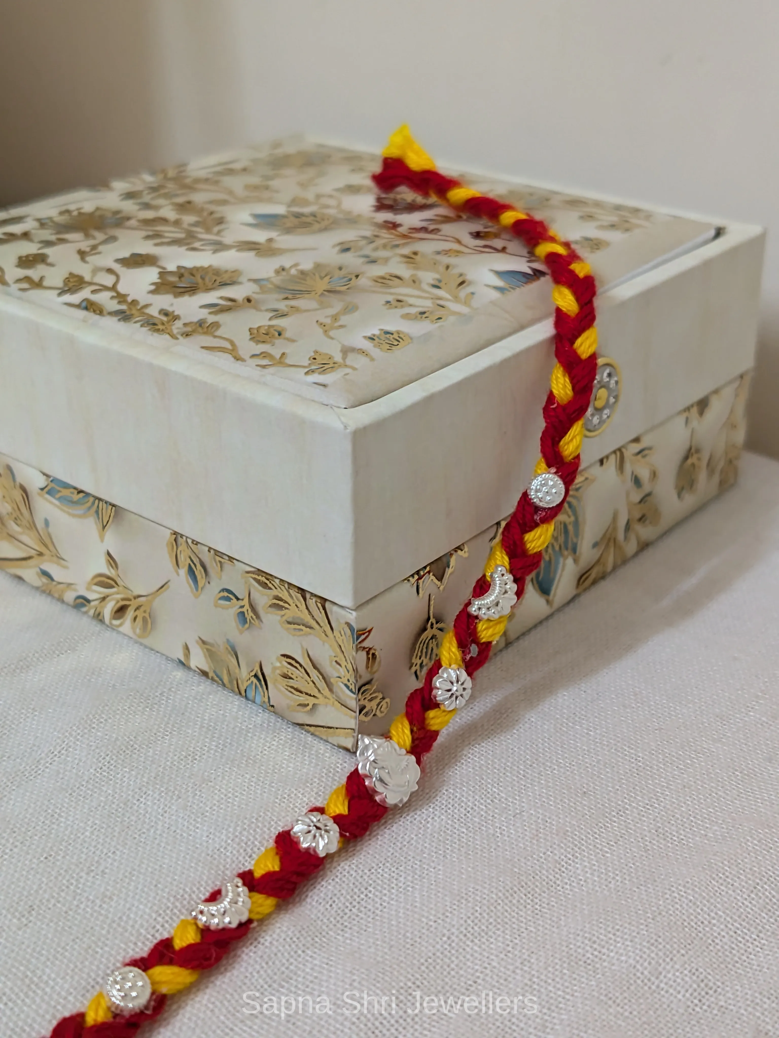 Ganesh Floral Silver Rakhi – Traditional Red Yellow Silver Rakhi thumbnail 3