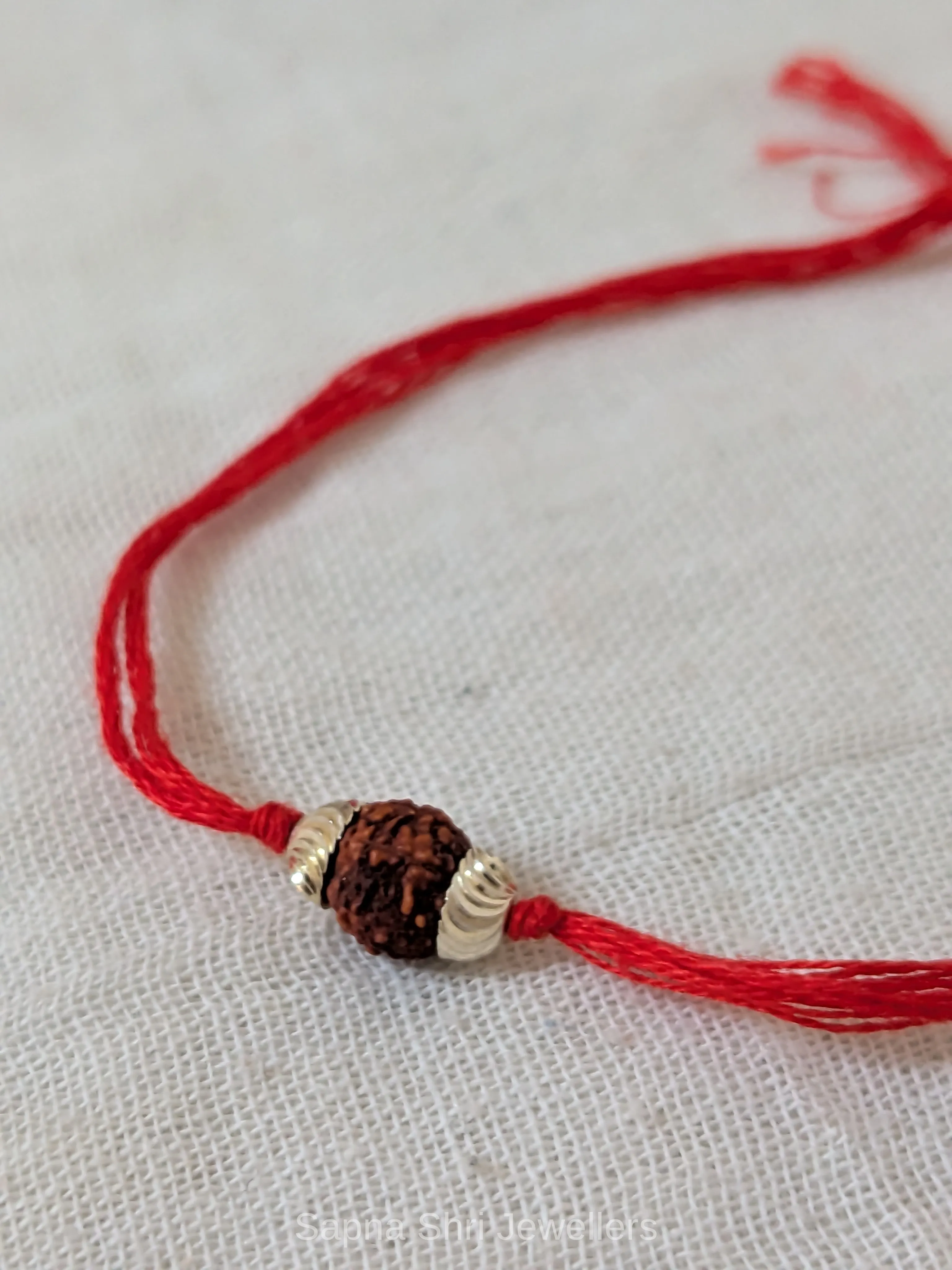 Single Rudraksha Silver Rakhi – Minimal Red Thread Rakhi thumbnail 2