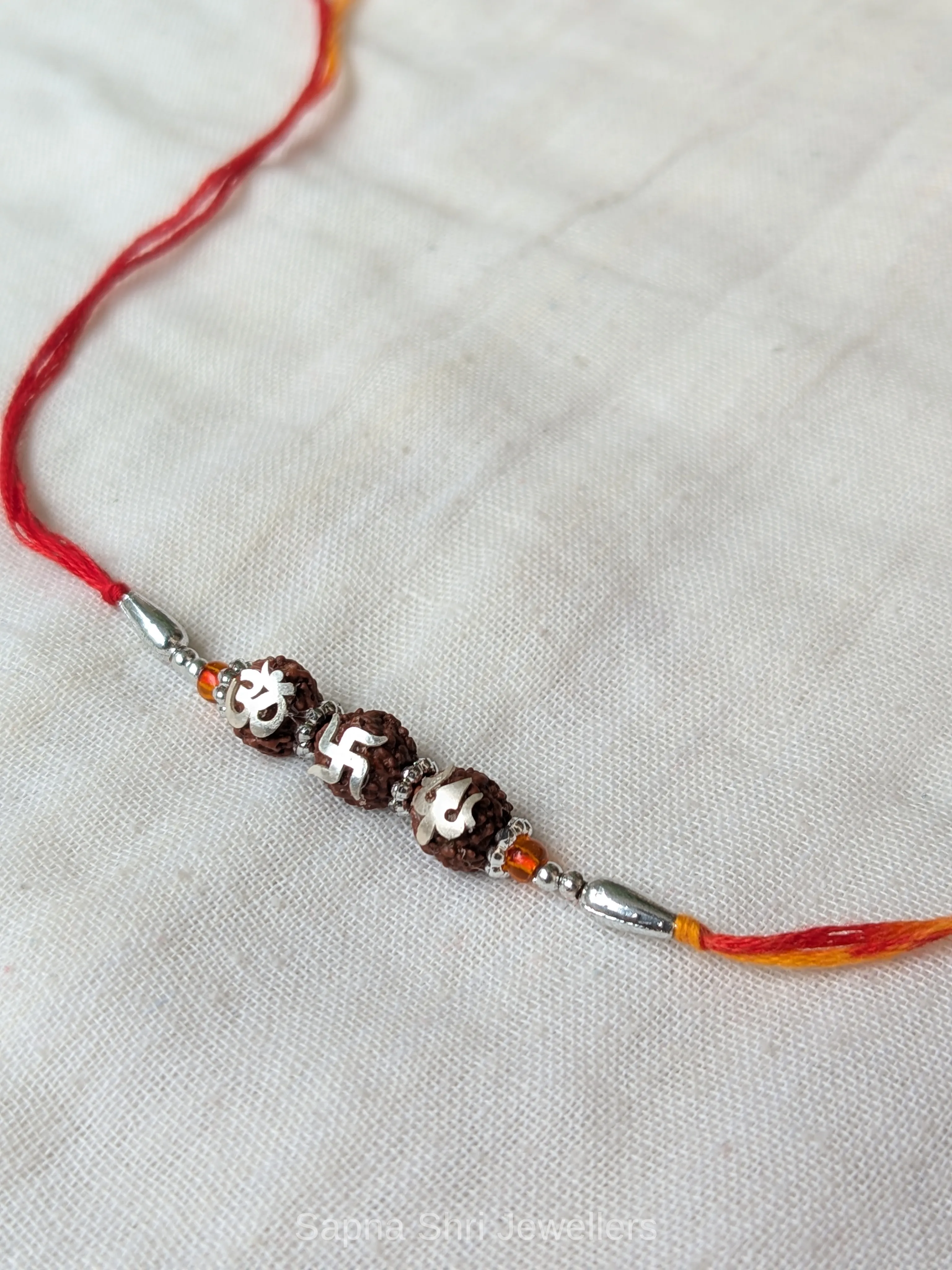 925 Silver Om Swastik Trishul Rudraksha Rakhi with Red & Yellow Mauli thumbnail 4