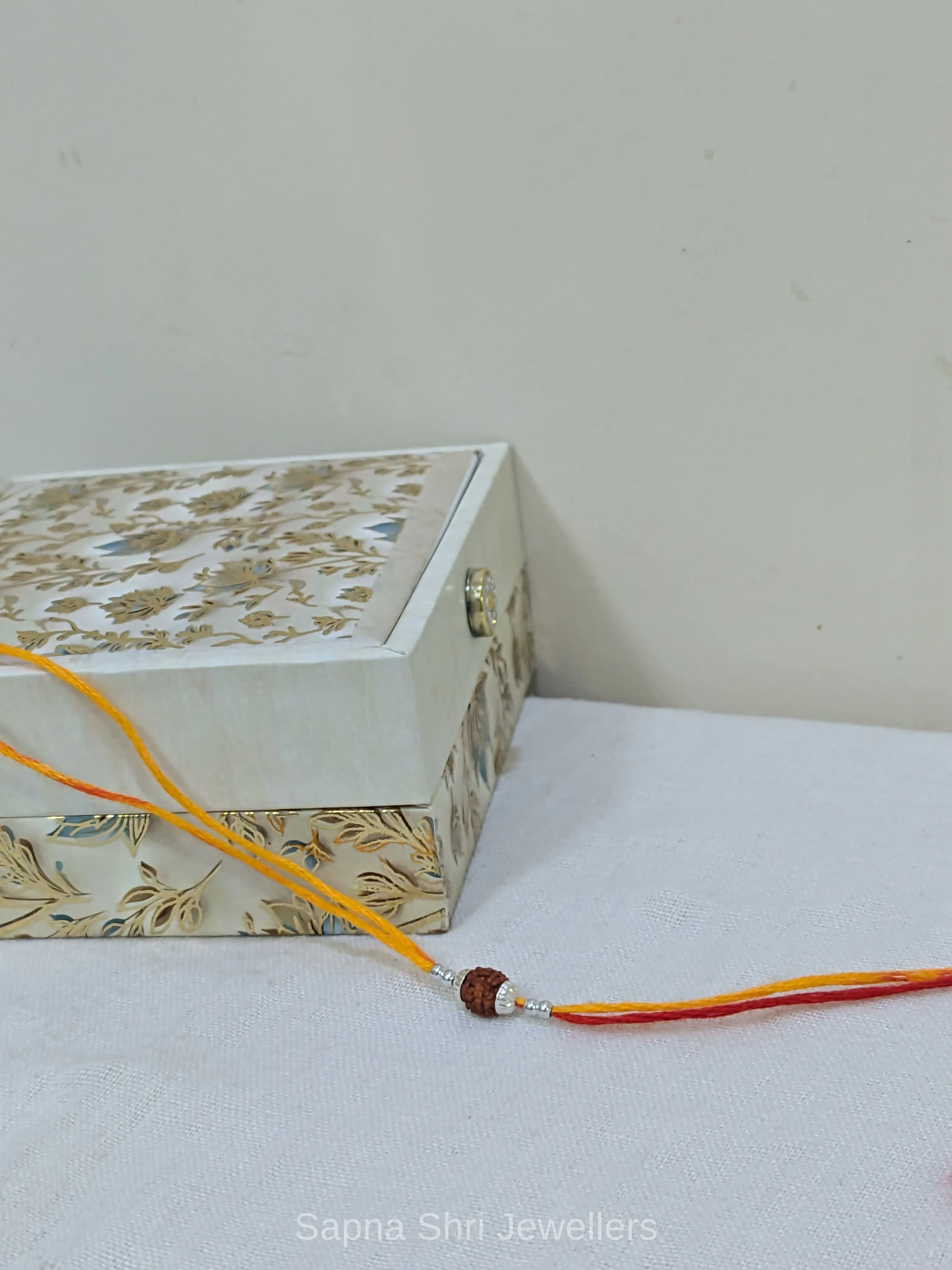 925 Silver Rudraksha Rakhi with Yellow & Red Mauli Thread thumbnail 3