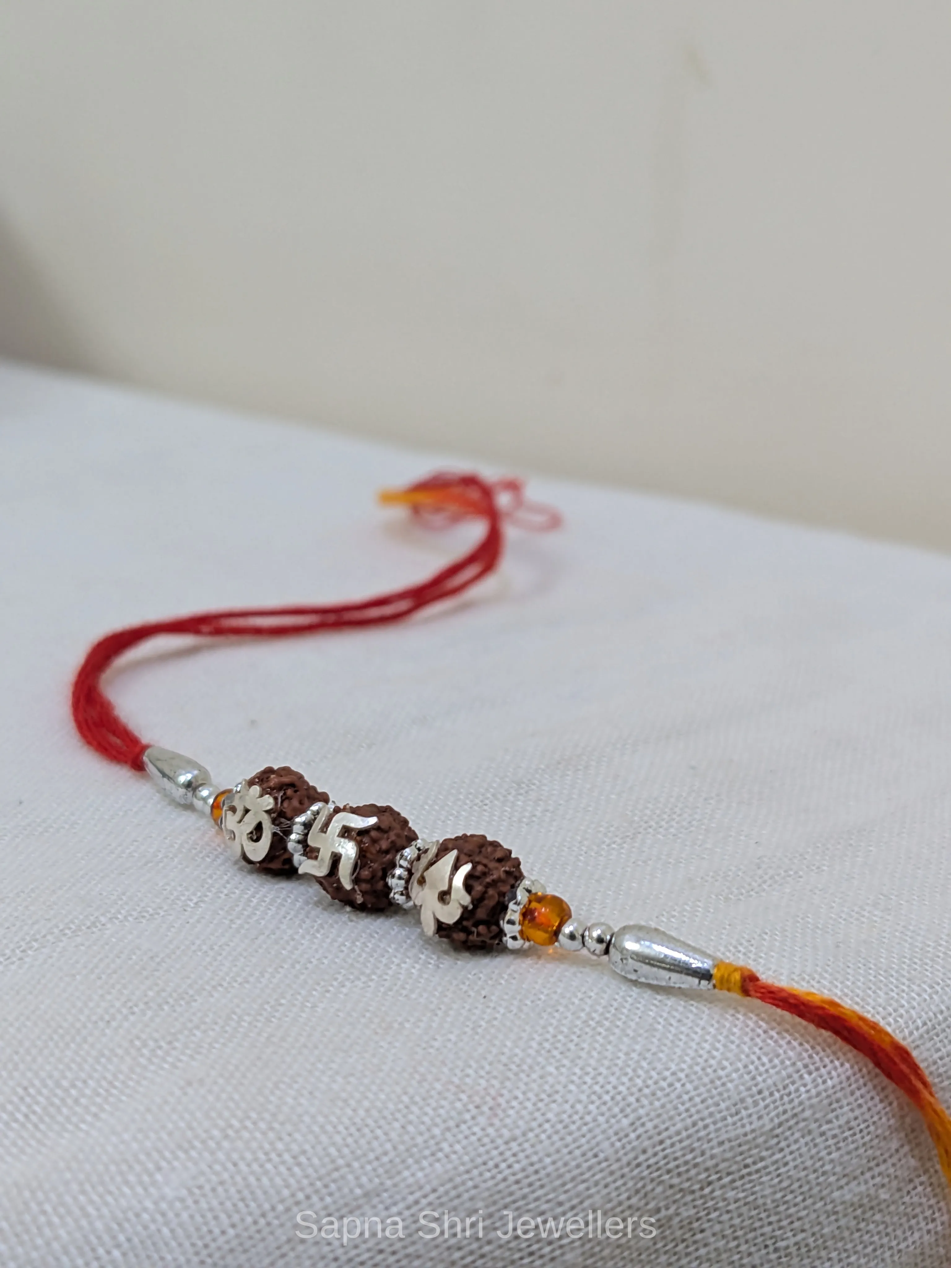 925 Silver Om Swastik Trishul Rudraksha Rakhi with Red & Yellow Mauli thumbnail 2