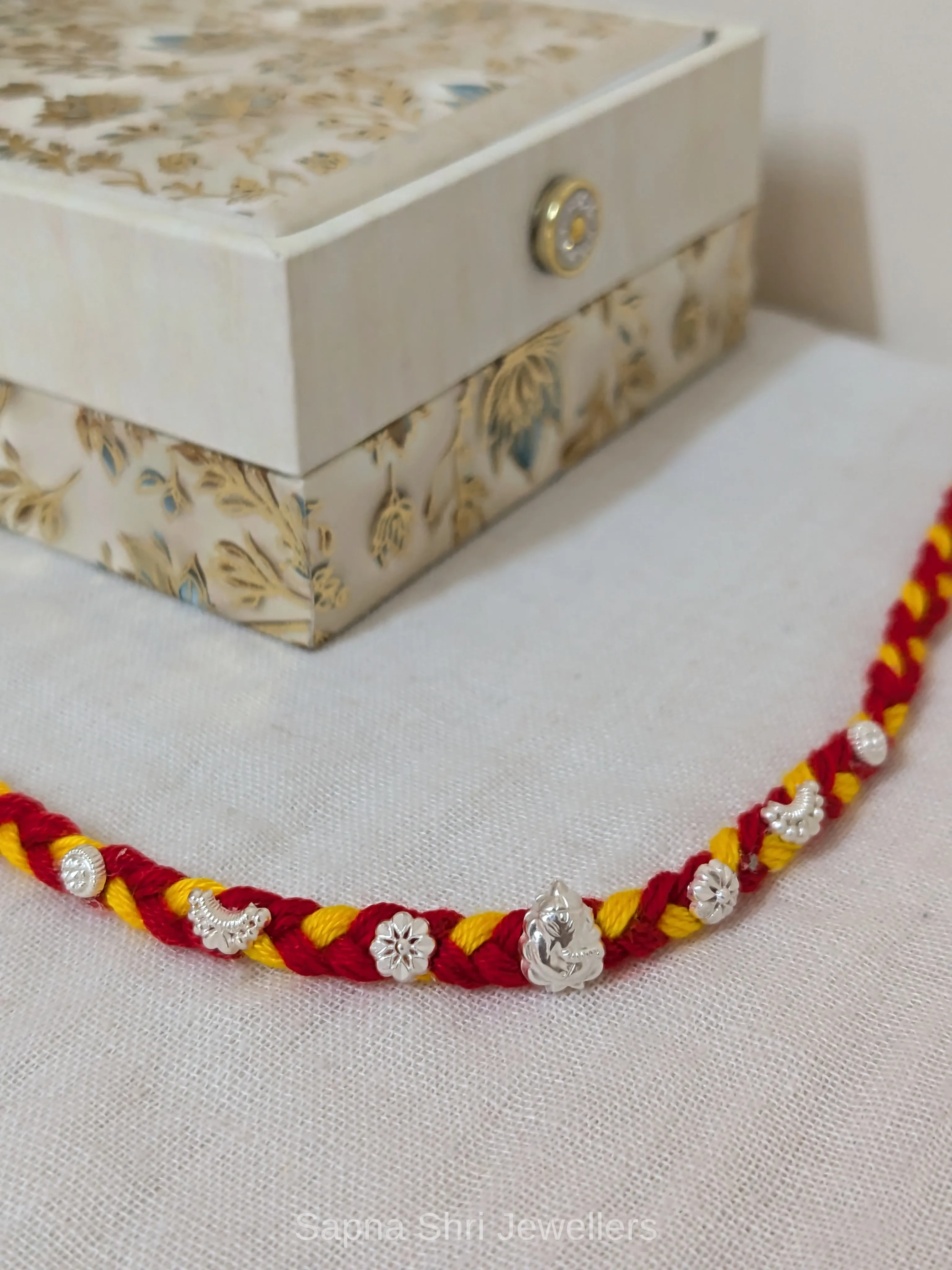 Ganesh Floral Silver Rakhi – Traditional Red Yellow Silver Rakhi thumbnail 2