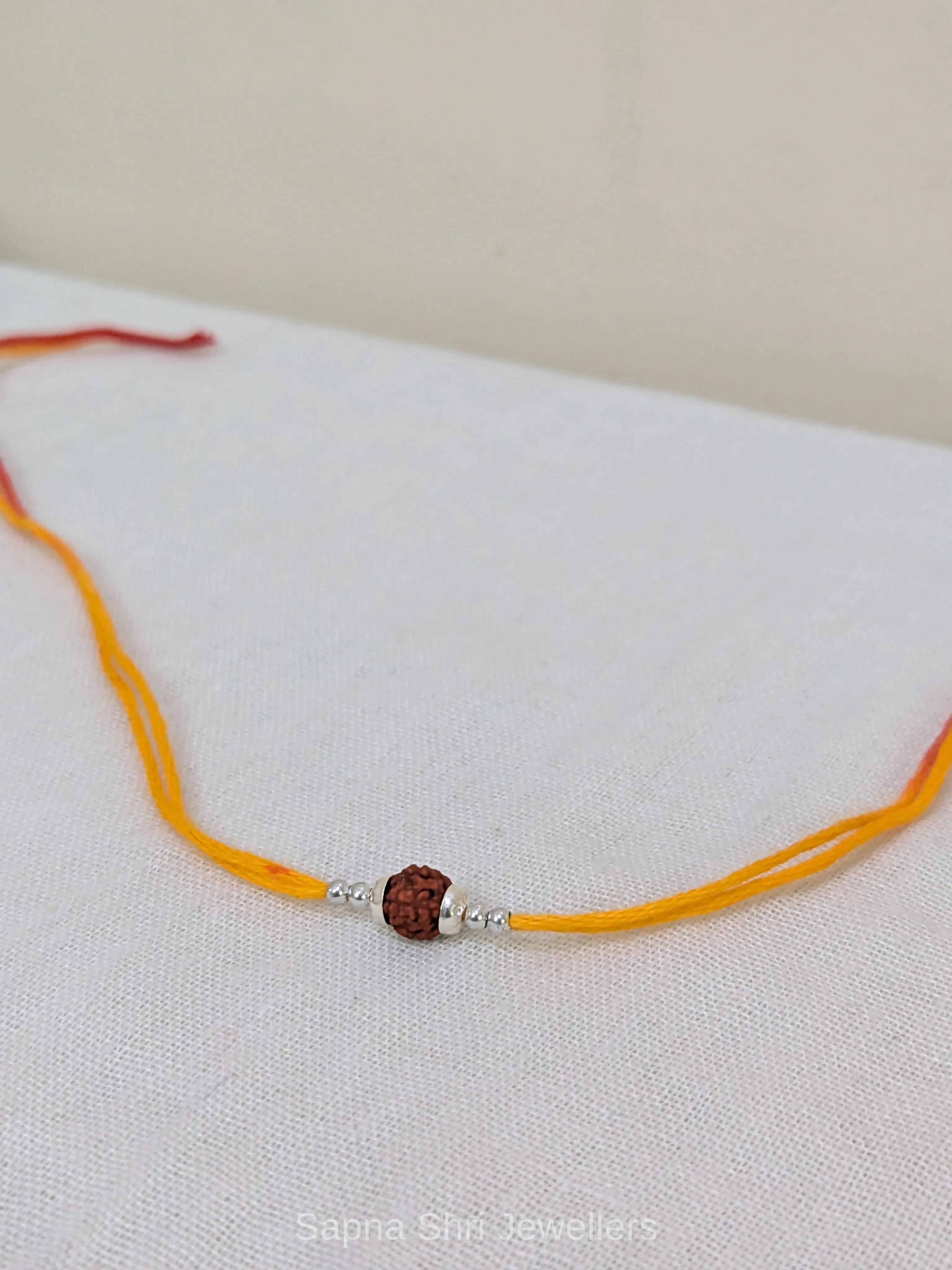 925 Silver Minimal Rudraksha Rakhi with Silver Beads & Mauli Thread thumbnail 4