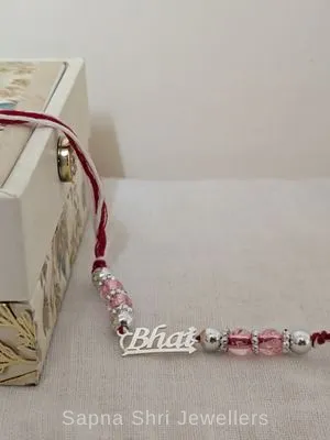 Pink Bead Bhai Silver Rakhi – Elegant Silver Rakhi for Brother Pink Bead Bhai Silver Rakhi – Elegant Silver Rakhi for Brother