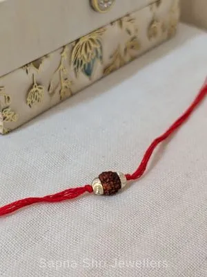 Single Rudraksha Silver Rakhi – Minimal Red Thread Rakhi