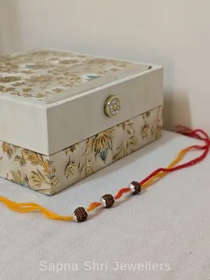 Three Rudraksha Silver Rakhi – Red & Yellow Spiritual Rakhi